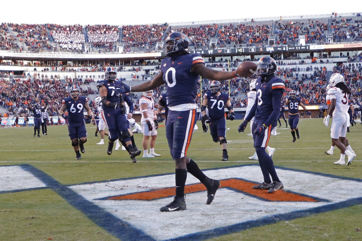 Nov 27, 2021; Charlottesville, Virginia, USA; Virginia Cavaliers tight end Jelani Woods (0) celebrates after scoring a touchdown against the Virginia Tech Hokies during the first quarter at Scott Stadium. Mandatory Credit: Geoff Burke-USA TODAY Sports